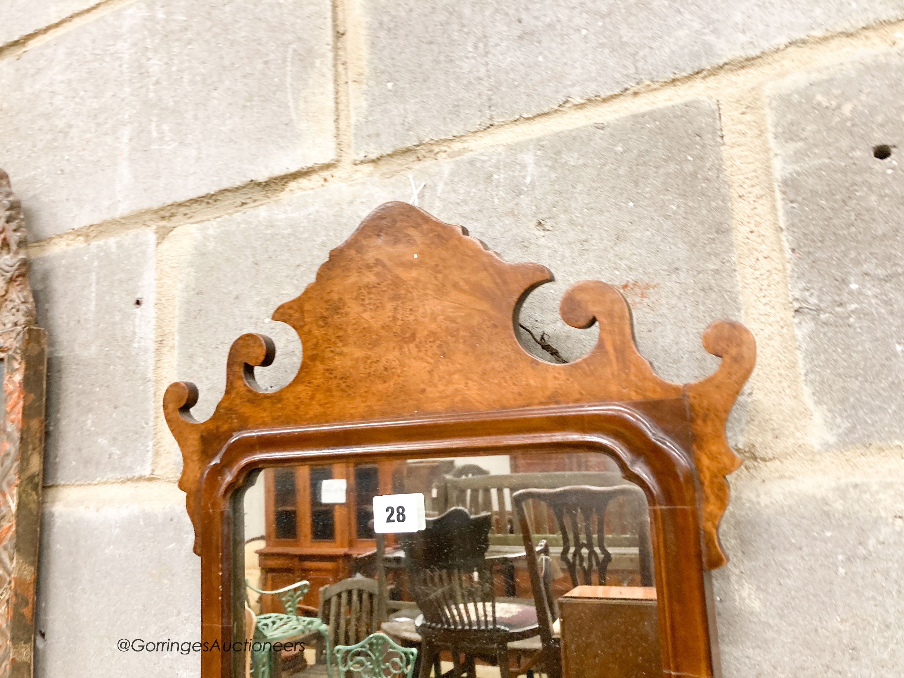 A pair of 18th century style walnut fret cut wall mirrors, width 42cm, height 70cm